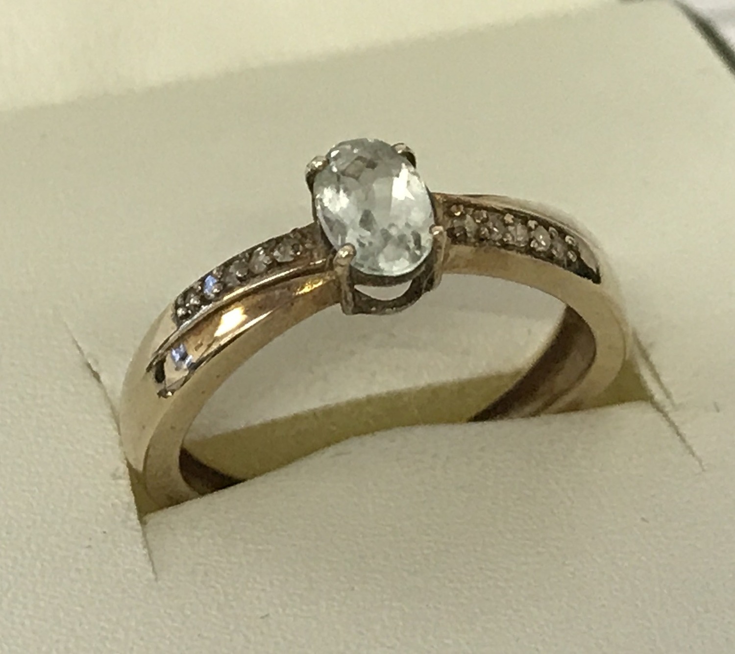 A 9ct gold aquamarine and moissanite dress ring.