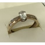 A 9ct gold aquamarine and moissanite dress ring.