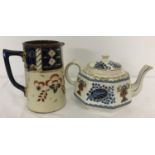 A decorative ceramic Sadler jug together with a colourful Gibsons teapot.