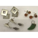 3 pairs of silver and white metal modern design earrings to include amber.