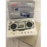 A vintage Aiwa CS-M1 stereo Microcassette recorder with 2-band radio.