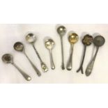 A collection of 8 silver and white metal salt spoons to include Victorian examples.