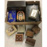 A box of assorted vintage tins and wooden boxes.