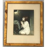 A framed & glazed vintage print of a young girl in prayer.
