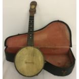 A vintage Dulcetta B.S 4 stringed banjolele in original carry case.