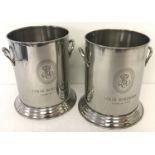 A pair of 2 handled Louis Roederer champagne coolers with engraved detail to front.