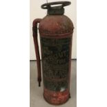 A vintage red Valor "Fyrout" extinguisher, with original hose attachment.