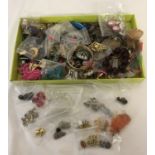 A box of mixed costume jewellery to include earrings, necklaces, bracelets and bangles.
