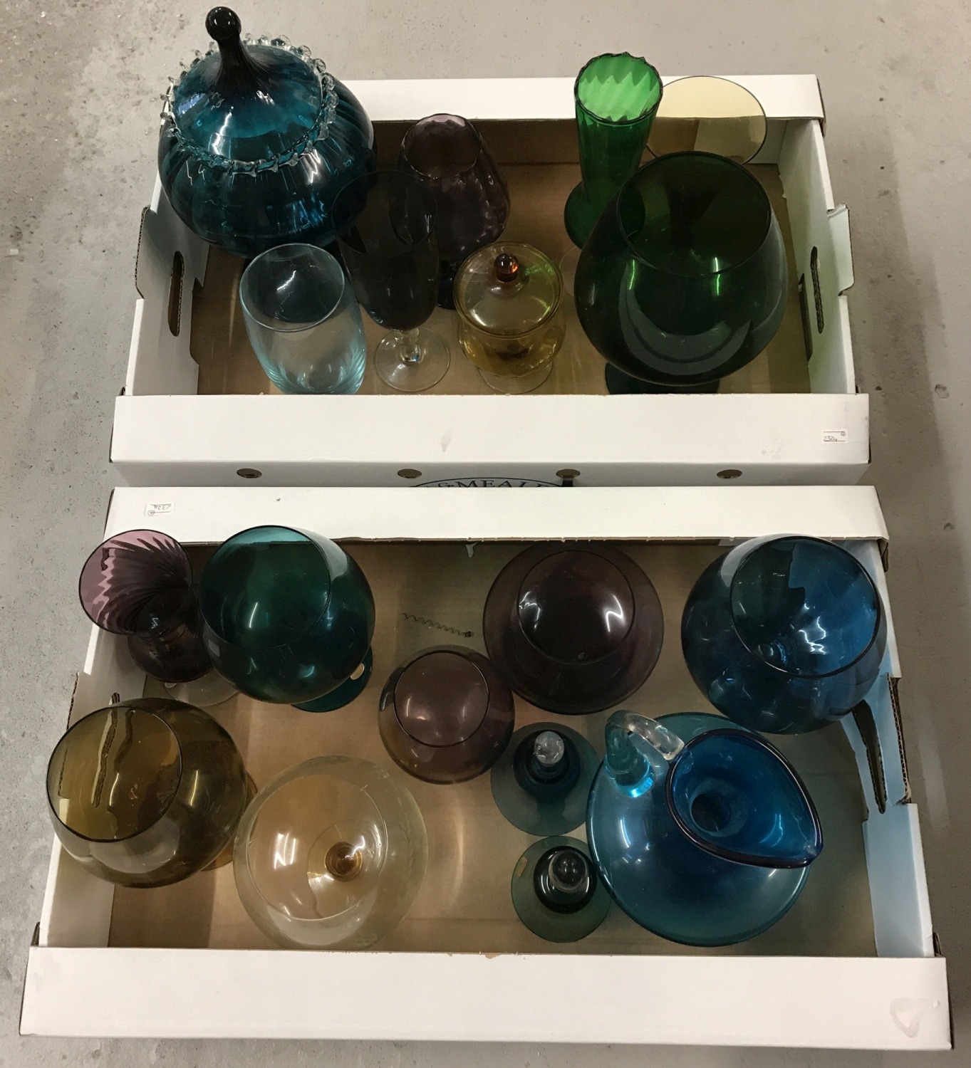 A large collection of vintage coloured glass items.