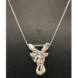 An Art Nouveau style, 3 dimensional fairy pendant on a silver 18" fine curb chain.