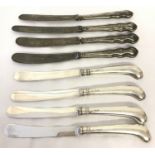 2 sets of 4 silver handled butter knives, hallmarked Sheffield 1909 and Sheffield 1918.