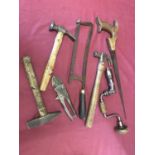 A small collection of antique and vintage tools.
