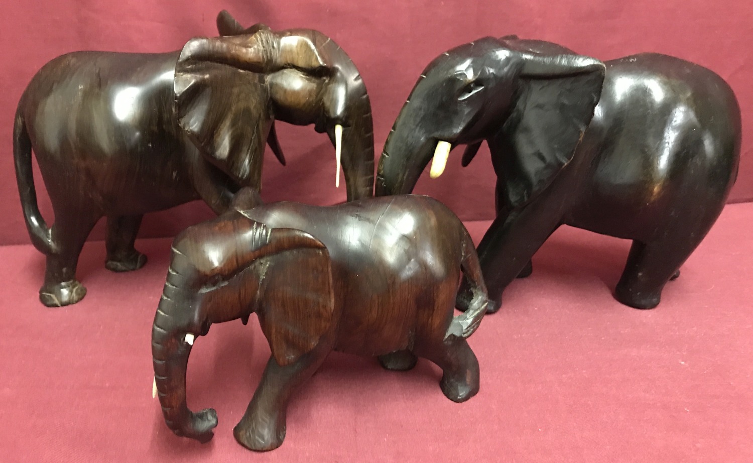 3 African hardwood elephant figures.