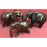 3 African hardwood elephant figures.