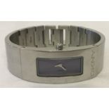 A ladies stainless steel bracelet watch by DKNY. Blue metallic face with silver hands.