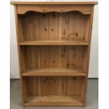 A small pine 2 shelf bookcase.