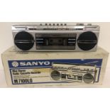 A 1980's Sanyo M7100LG Mini Stereo cassette recorder with 4-Band radio, in as new condition.
