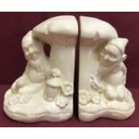 A pair of vintage children's plaster bookends.