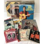 A box of assorted vintage records comprising 7", 12" and LP's.