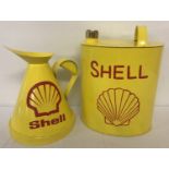 2 Shell oil cans painted yellow with red detail.