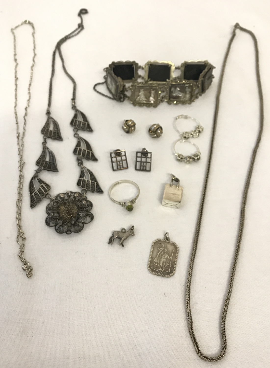 A collection of vintage silver and white metal jewellery.