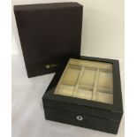 A new boxed Walwood watch box in a geometric design and high gloss finish.