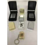 A collection of 8 unused windproof lighters, mostly by Ronson.