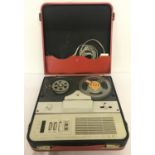 A vintage GEC portable reel to reel player/recorder in red carry case.