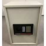 A boxed electronic metal safe by Kingavon.