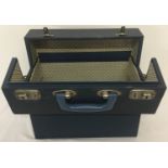 A vintage blue covered wooden LP/12 inch record case with carry handle.