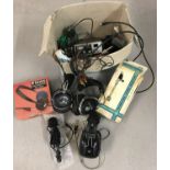A box of vintage sound recording accessories.