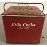 A vintage fibreglass insulated, painted metal Cola cooler.