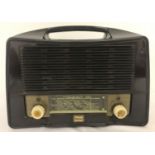 A vintage Bakelite radio with carry handle by Stella.