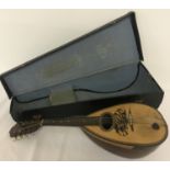 A vintage Carlo Ricordo, Italy, mandolin, in original carry case.