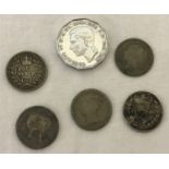 A collection of antique and vintage silver coins.