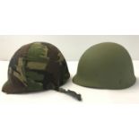 A Dutch para helmet with canvas camo cover and liner.