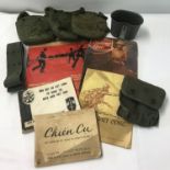 A collection of Vietnam War souvenirs to include webbing and ephemera.