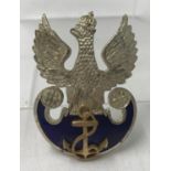 A WWII style Polish Naval Officers enamelled cap badge with screw back fixing.