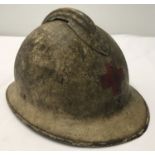 A WWII style French medic's steel helmet, no liner.