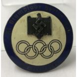 A German WWII style blue and cream enamelled 1936 Berlin Olympics pin back badge.