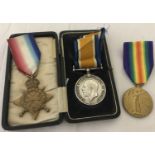 3 named WWI medals with ribbons, one cased.