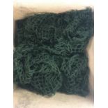 A quantity of 26 green military helmet nets.