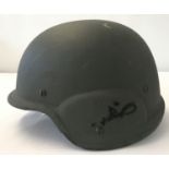 A South Korean PASGT kevlar helmet with canvas suspension lining and chin strap.