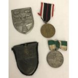 4 WWII stye German military shields and medals to inlcude Kuban and Stalingrad shields.