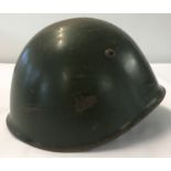 An Italian WWII M33 steel helmet, with leather lining and chin strap.