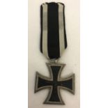 A copy of a WWI Iron Cross, 2nd class, on black and white ribbon.
