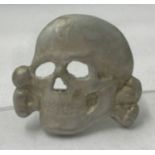 A German WWII style Waffen SS Totenkopf visor skull badge.