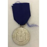 A WWII style SS 4 yr award medal.