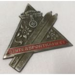 A WWII style German N.S.K.K. (National Socialist Motor Corps) winter sports badge.