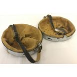 A pair of reproduction leather and metal helmet liners. Both with leather chin straps.